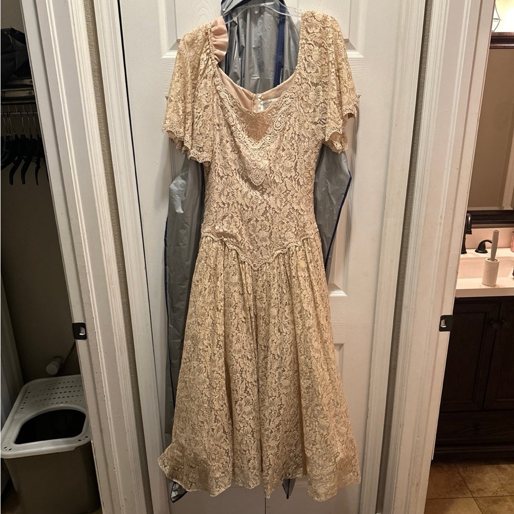 Vintage lace light pink dress from the 80’s, designer made and model worn.